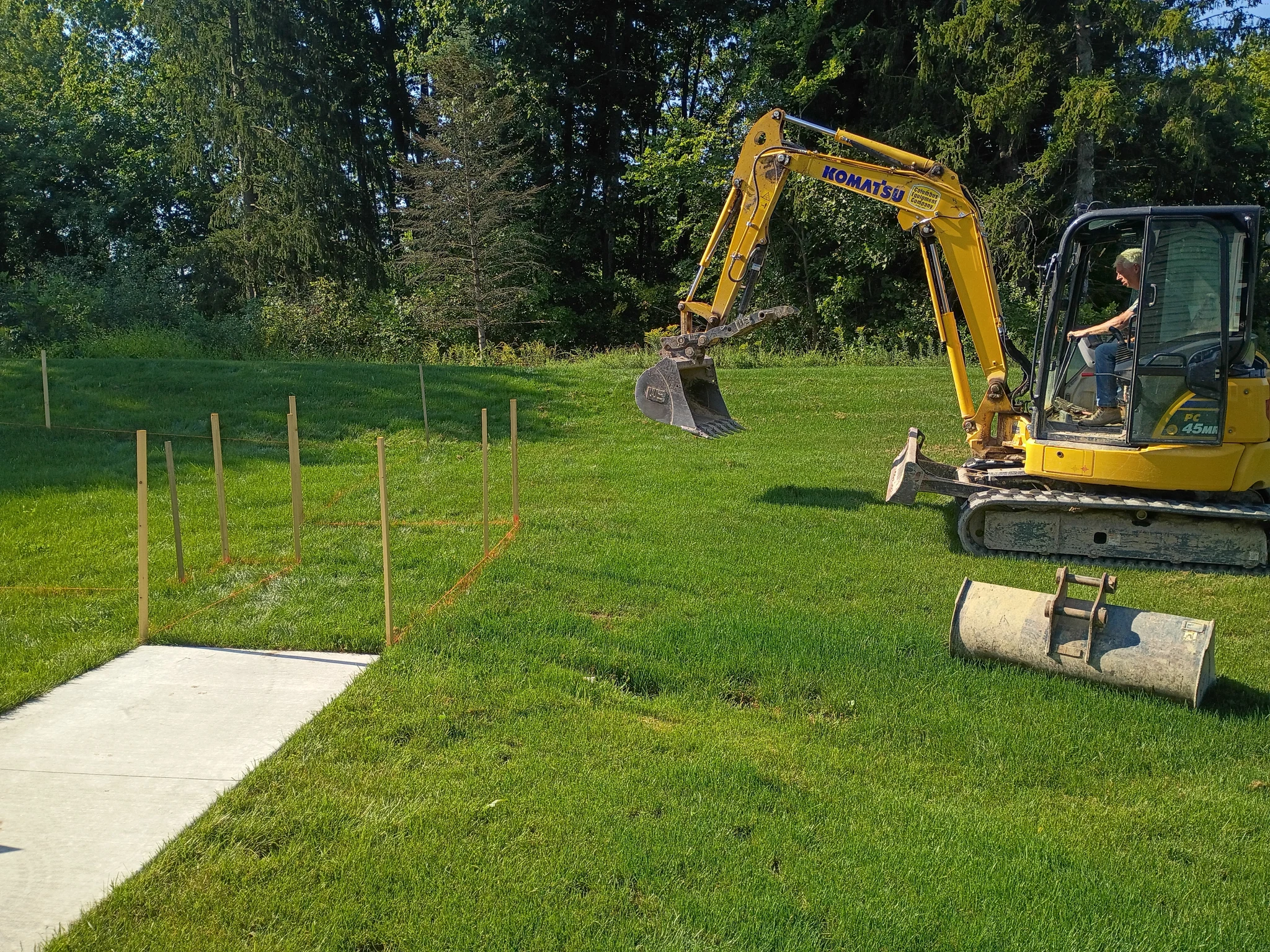 Excavation equipment and ground staking for the new community pavilion on the Briar campus grounds
