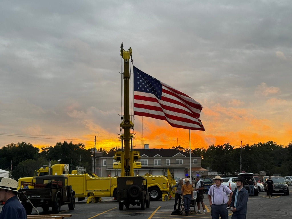 American Flag flying from crane at sunset at the Geauga Veterans Sport Fest