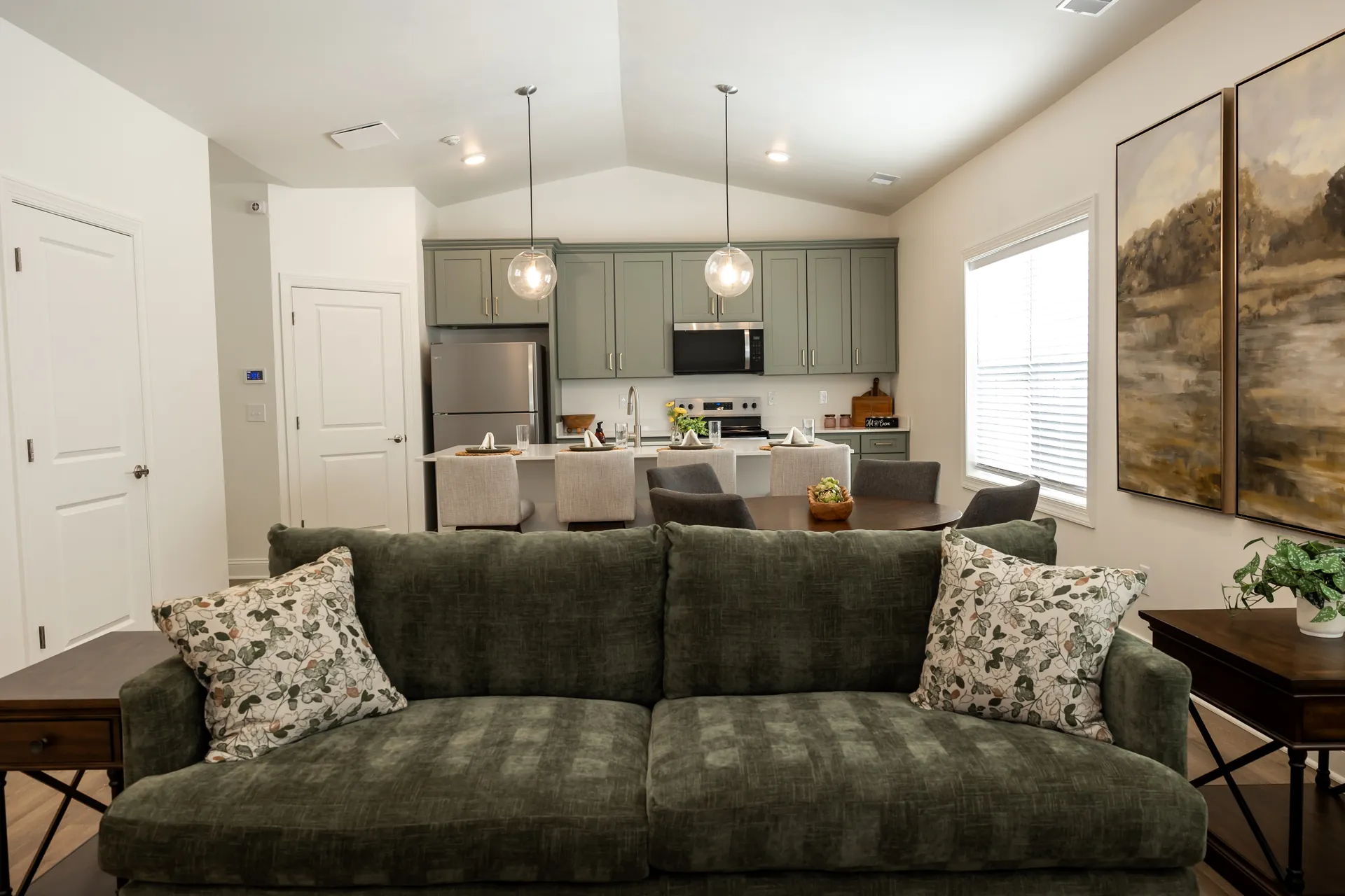 The Cottages open-concept living room with vaulted ceiling