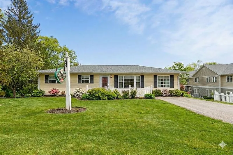 15965 Button St exterior with summer lawn